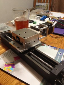 The z-axis attached to the x-axis via the adapter plate I designed in Solidworks and my friend made on his NC milling machine.